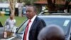 Presidential candidate Uhuru Kenyatta arrives to take part in a televised debate between presidential contenders, in Nairobi, Kenya, February 11, 2013. 