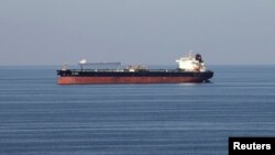 FILE - Oil tankers pass through the Strait of Hormuz, Dec. 21, 2018. 