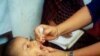 Child receiving polio vaccine.