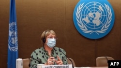 FILE - United Nations High Commissioner for Human Rights Michelle Bachelet looks on after delivering a speech on global human rights developments during a session of the Human Rights Council, in Geneva, June 21, 2021. 