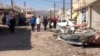 In this photo released by the Syrian official news agency SANA, a damaged area is seen after a car bomb explosion in Qatana, southwest of Damascus, Syria, Dec. 13, 2012.