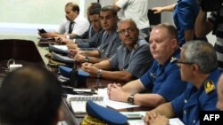 An Algerian crisis unit meets at the Houari-Boumediene International Airport in Algiers, July 24, 2014 following the disappearance of an Air Algerie plane over Mali.