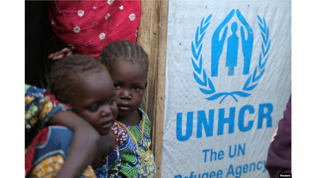 Children stand at the door of their house at a camp for internally displaced people in Maiduguri, Nigeria Nov. 29, 2016.