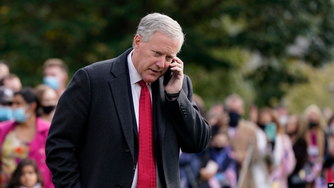 FILE - In this Oct. 30, 2020, photo, White House chief of staff Mark Meadows speaks on a phone on the South Lawn of the White House in Washington. Meadows has been diagnosed with coronavirus. 