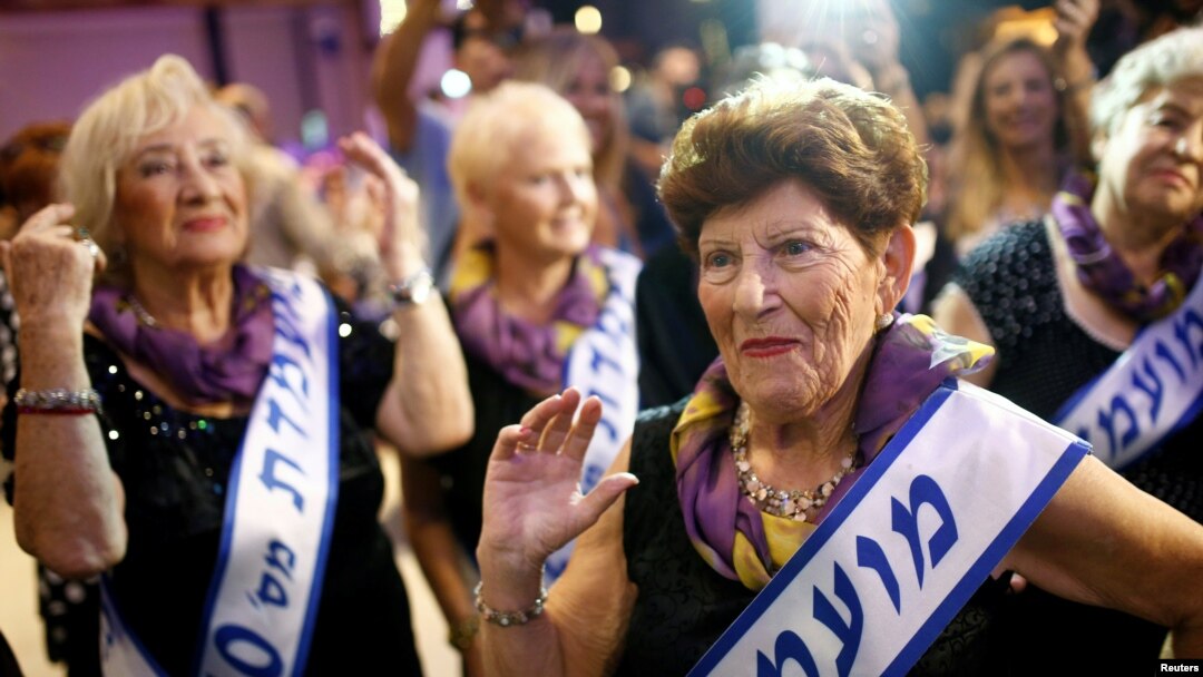 Holocaust survivor Carmela Ben Yehuda, 89, dances during the annual Holocaust survivors' beauty pageant in the Israeli city of Haifa, Oct. 30, 2016.