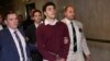 Luigie Mangione is escorted into Manhattan Criminal court for his arraignment on state murder and terror charges in the killing of UnitedHealthcare CEO Brian Thompson, Dec. 23, 2024, in New York.