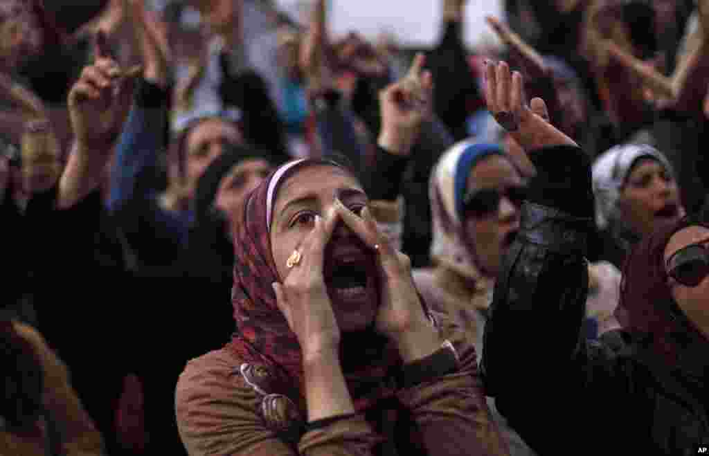 Egyptian protesters chant anti-government slogans during a rally in Tahrir Square, Cairo, Egypt, Feb. 1, 2013. 