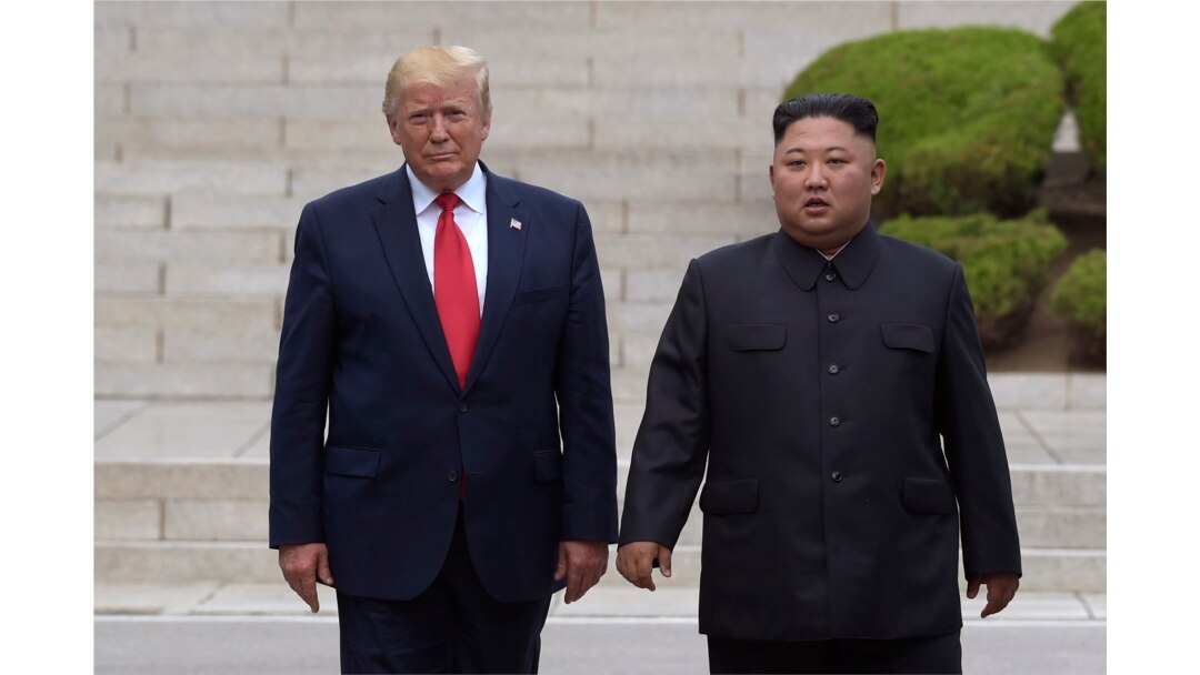 President Donald Trump, left, meets with North Korean leader Kim Jong Un at the North Korean side of the border at the village of Panmunjom in Demilitarized Zone, Sunday, June 30, 2019.