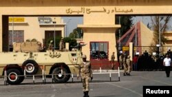 Egyptian Army soldiers guard gates during police protest at main crossing into Gaza Strip, near Rafah, May 19, 2013.
