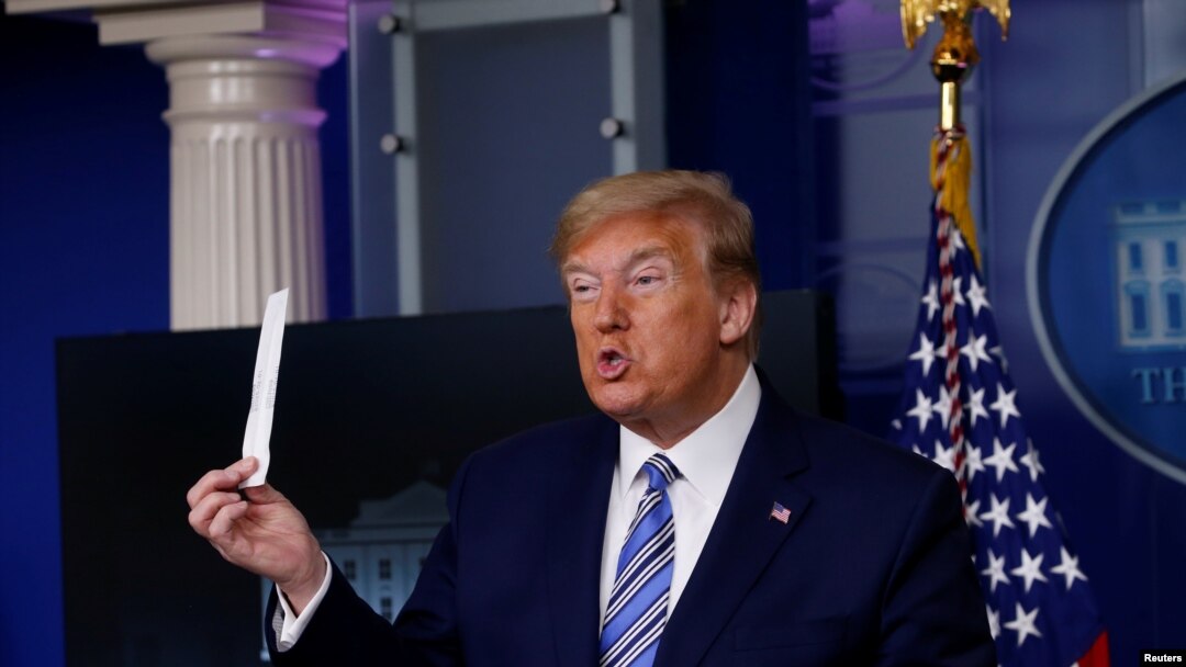 U.S. President Donald Trump shows a packaging containing a swab to be used for coronavirus disease (COVID-19) testing during the daily coronavirus task force briefing at the White House in Washington, U.S., April 19, 2020.