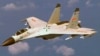中国歼-11战机在海南岛以东上空抵近美国海军侦察机飞行（2014年资料照）