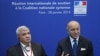 French Foreign Affairs Minister Laurent Fabius (r) and Syrian National Coalition vice-president Riad Seif attend a press conference during the International support meeting of the Syrian National Coalition in Paris, Jan. 28, 2013. 