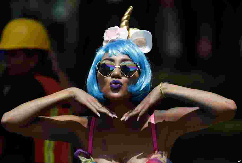 A reveler pauses for a portrait during Mexico City's gay pride parade, June 24, 2017.