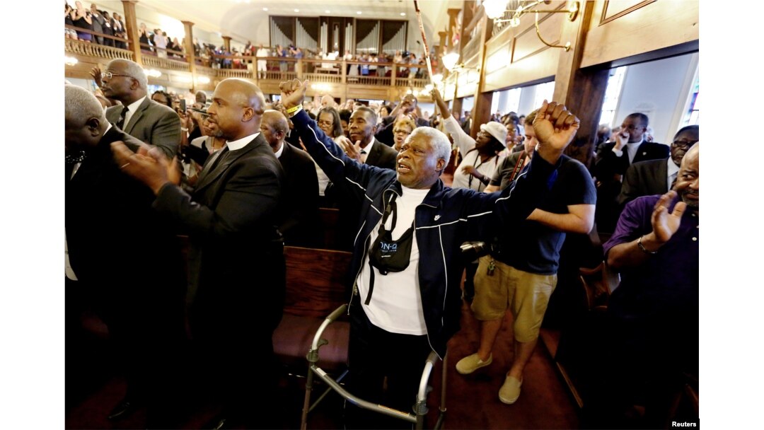 Rev. Sandy Drayton, reacts during a prayer vigil held at Morris Brown AME Church in Charleston, South Carolina, June 18, 2015.