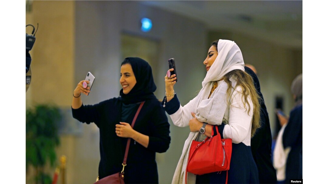 FILE - Saudi people attend the concert of composer Yanni at Princess Nourah bint Abdulrahman University in Riyadh, Saudi Arabia, Dec. 3, 2017.
