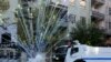 Riot police use water cannon as demonstrators throw fireworks during a protest against the curfew in Sur district, in the Kurdish dominated southeastern city of Diyarbakir, Turkey, December 8, 2015. 