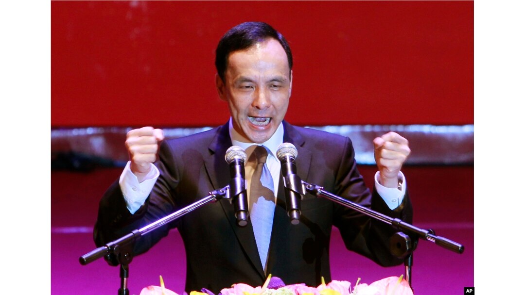Taiwan's ruling Nationalist Party chairman and presidential candidate in the 2016 elections, Eric Chu, gestures during an extraordinary party congress in Taipei, Taiwan, Saturday, Oct. 17, 2015.