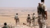 FILE - Fighters allied with Syria Democratic Forces (SDF) are seen near Manbij, northern Syria, June 1, 2016. Turkmen commander Hani al-Mulla was losely affiliated with the SDF.