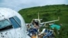 Officials inspect the wreckage of an Air India Express jet at Calicut International Airport in Karipur, Kerala, on Aug. 8, 2020.