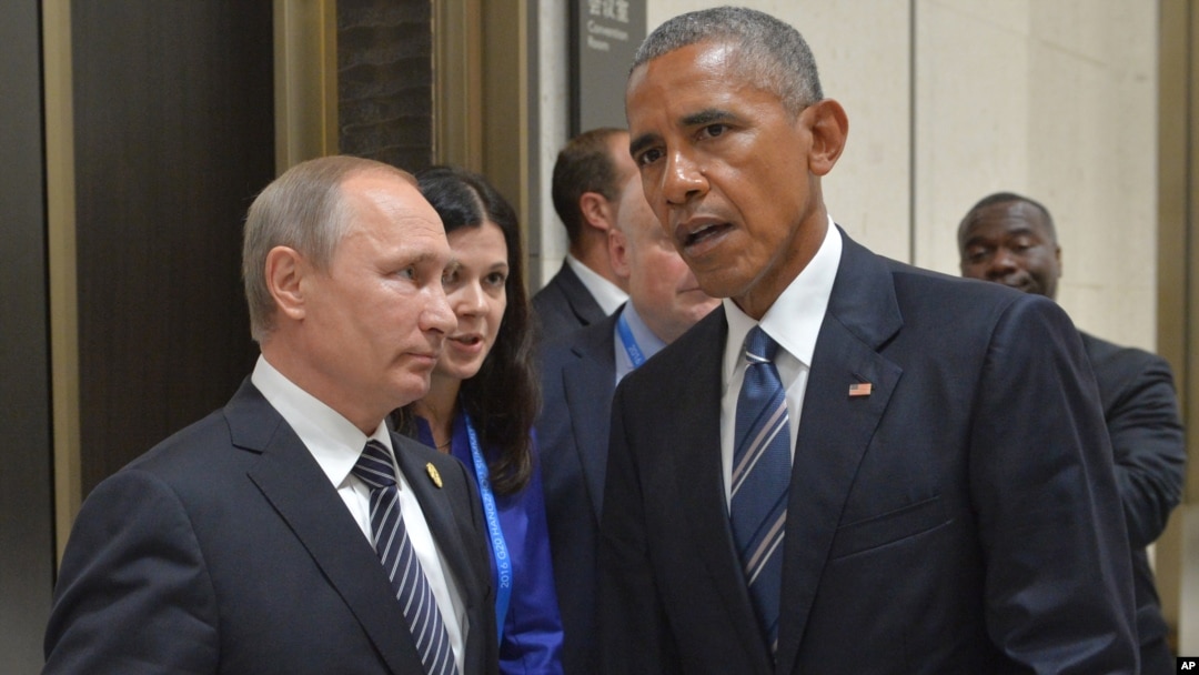 Russian President Vladimir Putin, left, listens to U.S. President Barack Obama in Hangzhou in eastern China's Zhejiang province, Sept. 5, 2016.
