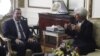 IMF Managing Director Christine Lagarde talks with Egypt's Prime Minister Hisham Qandil at the cabinet headquarters in Cairo, August 22, 2012.