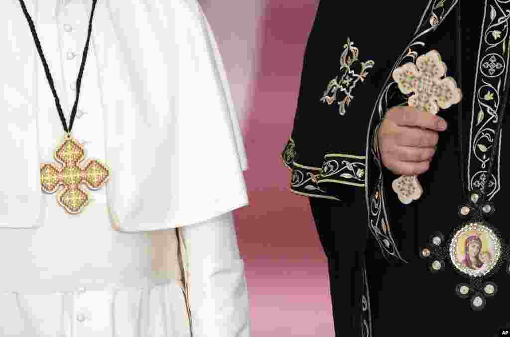 Pope Francis stands by Pope Tawadros II, spiritual leader of Egypt's Orthodox Christians, at Cairo's St. Mark's Cathedral.