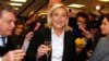 Marine Le Pen (C), France's far-right National Front political party leader, and National Front party deputy Gilbert Collard (L) attend the presentation of New Year wishes to the media in Nanterre, Jan. 7, 2014. 