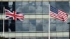 FILE - A British Union flag (L) and U.S. flag are seen flying in front of an office building in London, March 30, 2016. Post-Brexit relations between the two countries have been a matter of debate.