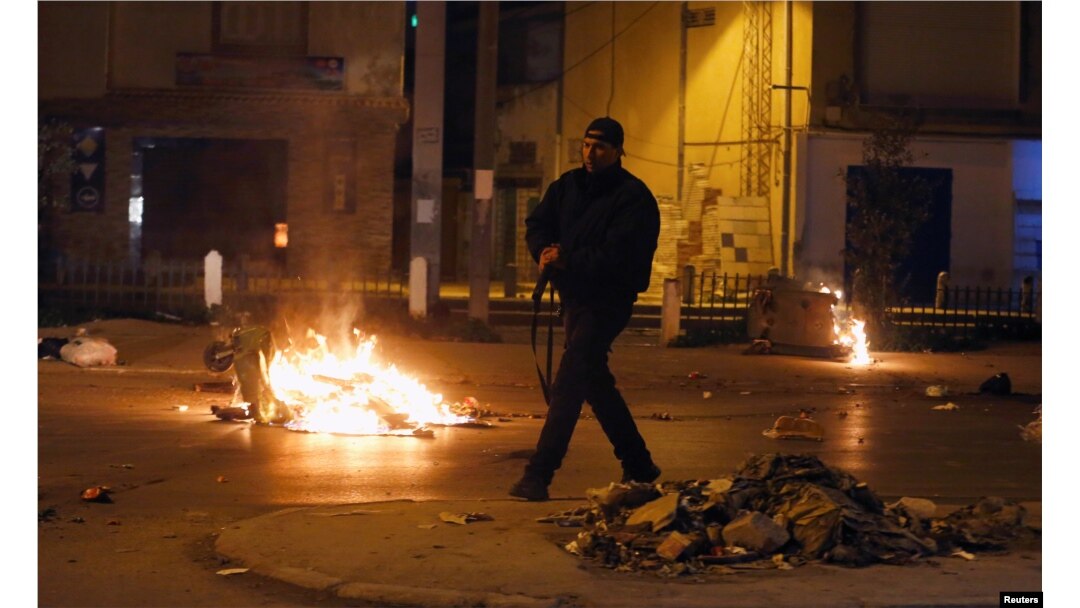 Riot police clash with protesters during demonstrations against rising prices and tax increases, in Tunis, Tunisia, Jan. 10, 2018.