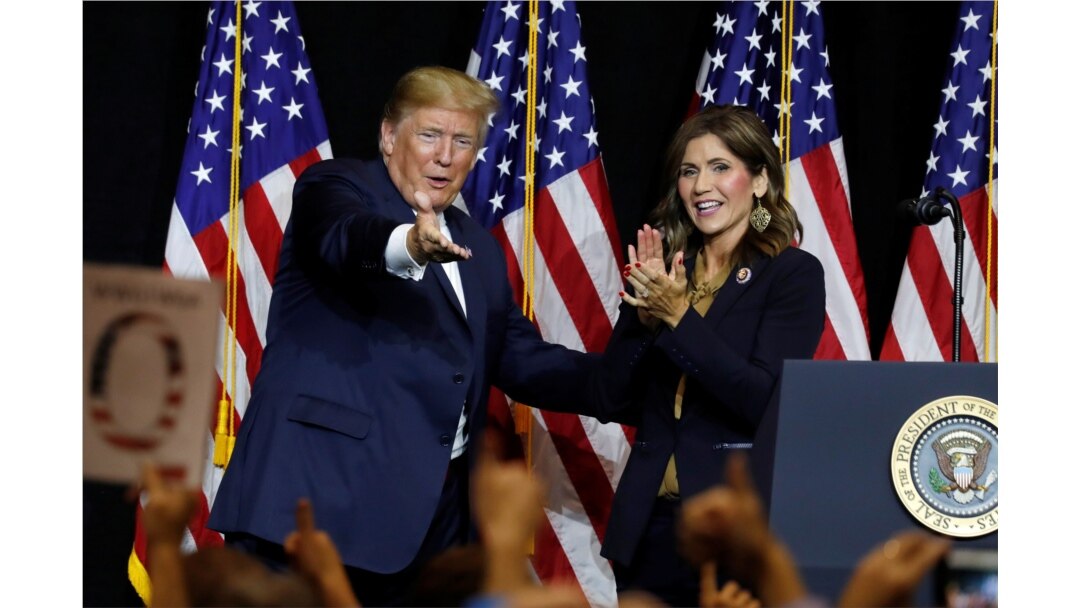 FILE - FILE- President Donald Trump and Governor Kristi Noem.