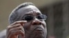 Ghana's President John Evans Atta Mills (left) with President Obama at the White House, Mar 8, 2012 