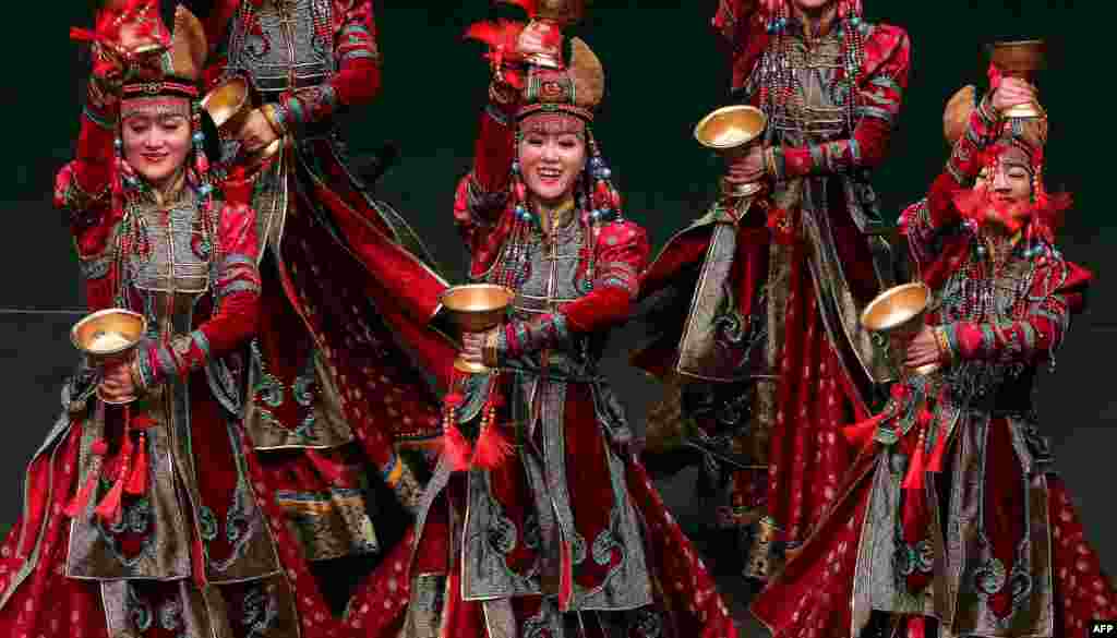 Dancers from China's Inner Mongolia Art Troupe perform at the Abdulhusain Abdulredha theatre in Kuwait City, Kuwait.