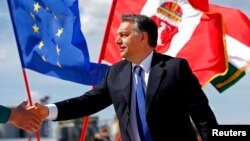Hungarian Prime Minister Viktor Orban attends stone laying ceremony for a new division of Knorr-Bremse factory in Kecskemet, April 11, 2013.