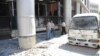Photo released by Syria's national news agency shows wreckage of a bus after a bombing in the al-Zablatani area, Damascus, October 9, 2012.