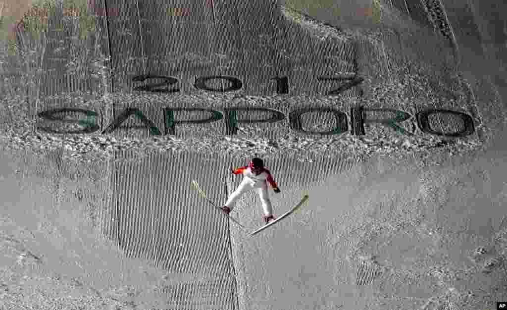 Japan's Naoki Nakamura soars through the air in his second round jump at the ski jumping men's large hill individual at the Asian Winter Games in Sapporo, northern Japan.