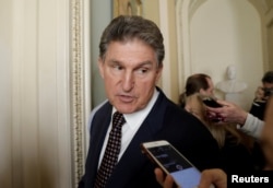 FILE - U.S. Senator Joe Manchin (D-WV) talks to reporters on Capitol Hill, Jan. 19, 2018.