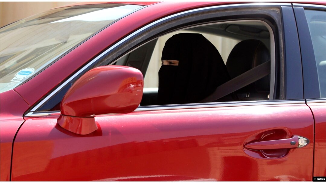FILE - A woman drives a car in Saudi Arabia, Oct. 22, 2013.