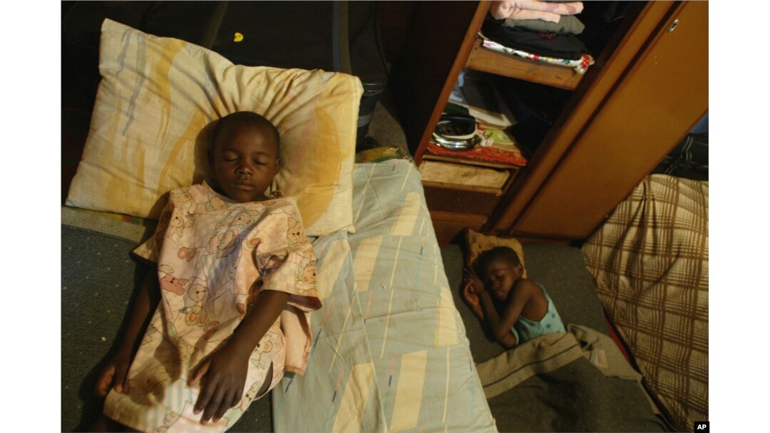 FILE - Children take an afternoon nap at an orphanage in Harare, Zimbabwe, May 26, 2006.