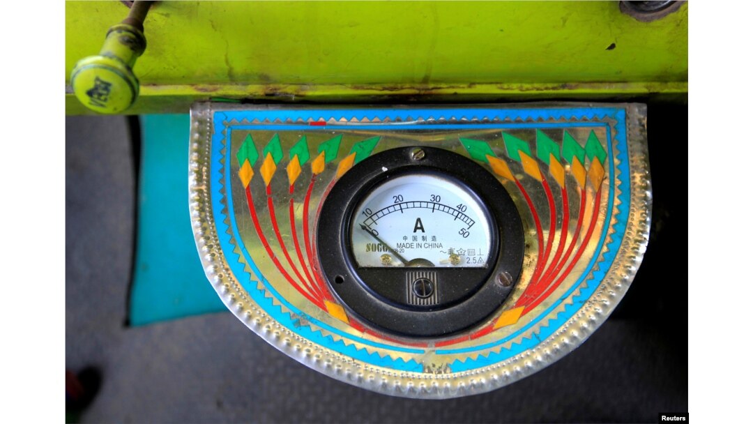An electric gauge is seen in the cab of a decorated truck in Faisalabad, Pakistan, May 4, 2017.