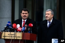Istanbul Gov. Vasip Sahin, left, accompanied by Police Chief Mustafa Caliskan, talks to the media during a news conference regarding the arrest of a suspect of New Year's nightclub attack in Istanbul, Jan. 17, 2017.