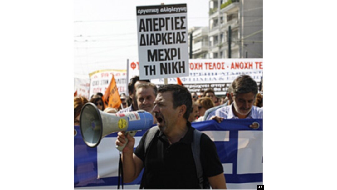 Protesters shout slogans during demonstration in Athens, Greece, October 5, 2011.