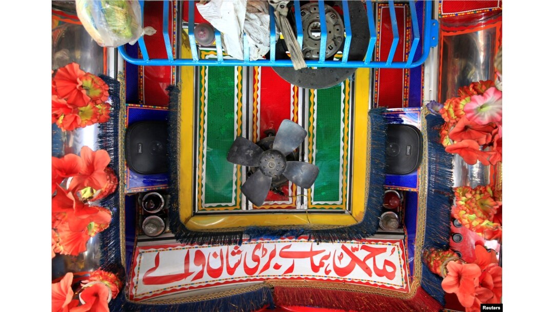 Speakers and a fan are seen in the cab of a decorated truck in Faisalabad, Pakistan, May 4, 2017.