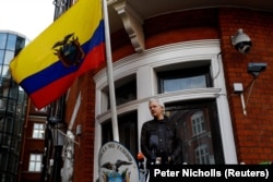 WikiLeaks founder Julian Assange is seen on the balcony of the Ecuadorian Embassy in London
