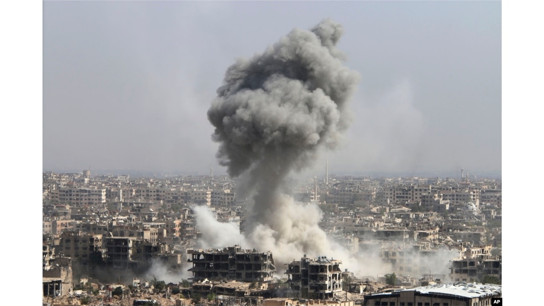 Smoke rises after shelling by the Syrian army, after Russian airstrikes, in Damascus, Syria, Oct. 14, 2015.