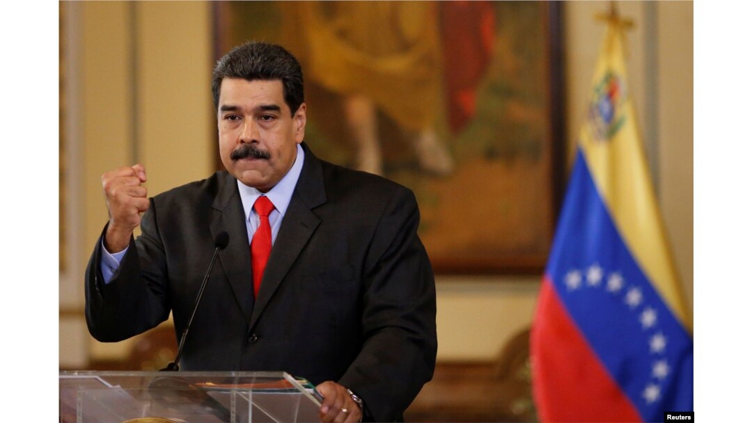 Venezuela's President Nicolas Maduro gestures as he talks to the media during a news conference in Caracas, Venezuela, Feb. 15, 2018.