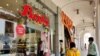 Shutters are lifted and shops spruced up as Delhi's markets open after two months as lockdown restrictions are eased. (Anjana Pasricha/VOA)