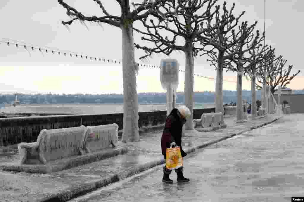 A dock on Lake Leman, covered in ice, is pictured on a cold windy winter day in Versoix near Geneva, Switzerland.
