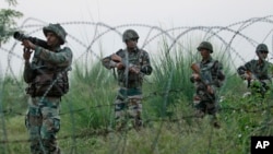 FILE - Indian army soldiers patrol near the highly militarized Line of Control dividing Kashmir between India and Pakistan, in Pallanwal sector, about 75 kilometers from Jammu, India, Oct. 4, 2016. 
