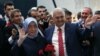 Binali Yildirim, Turkey's current Transportation Minister and founding member of the AKP, Turkey’s governing party, and his wife Semiha Yildirim salute supporters during party congress in Ankara, May 22, 2016. 