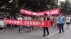 Local residents march during a protest along a street in Shifang, Sichuan province July 3, 2012.